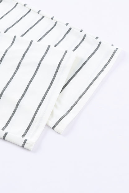 close-up on fabric of a white cotton pajama with stripes