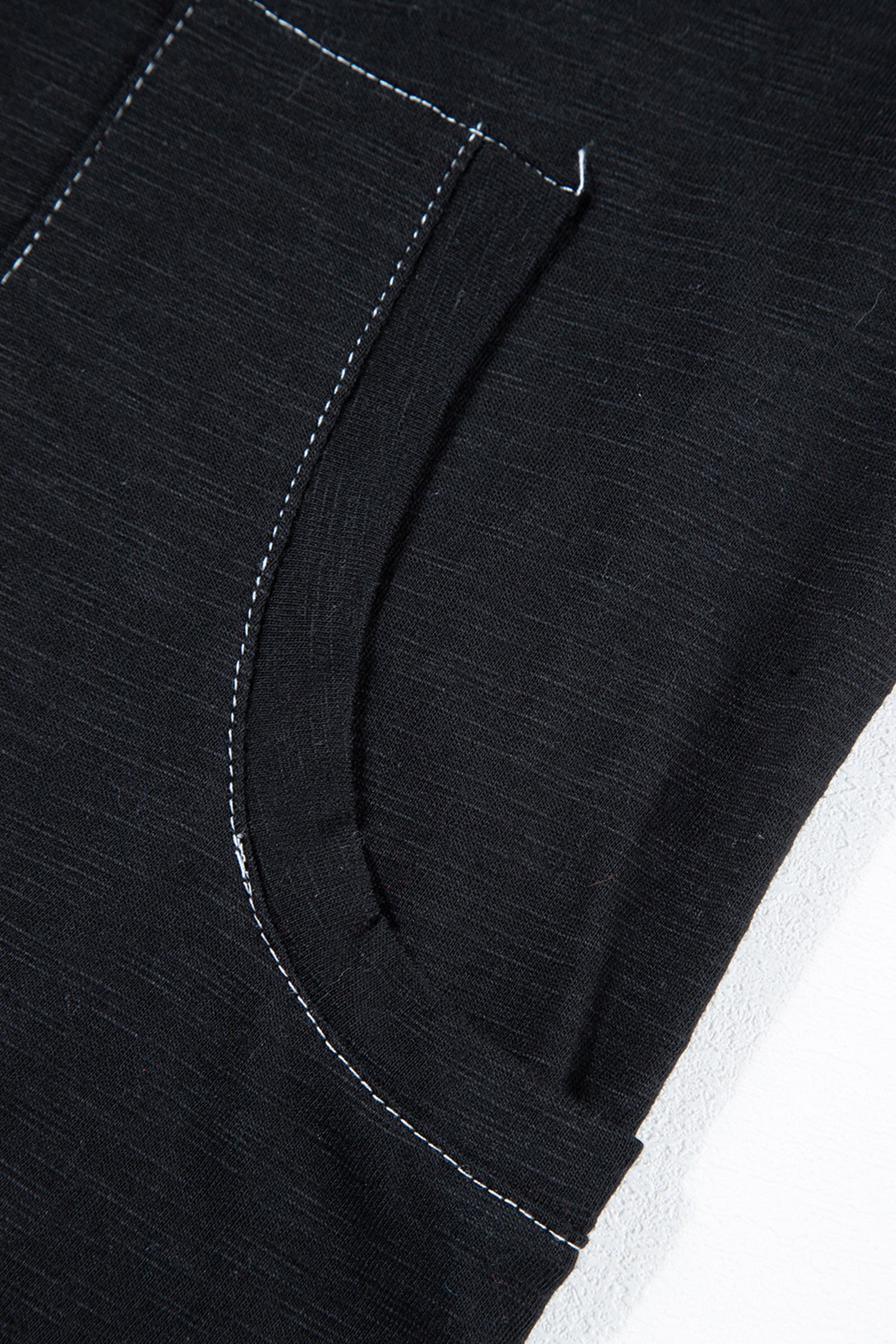 Close-up of a Black Baggy Onesie